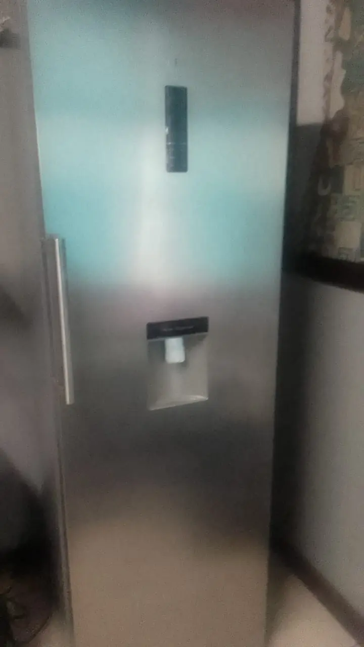 Modern fridge-freezer serviced at a customer property